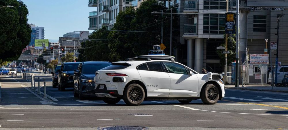 Self-driving car at a city intersection, illustrating new global rules for automated driving systems