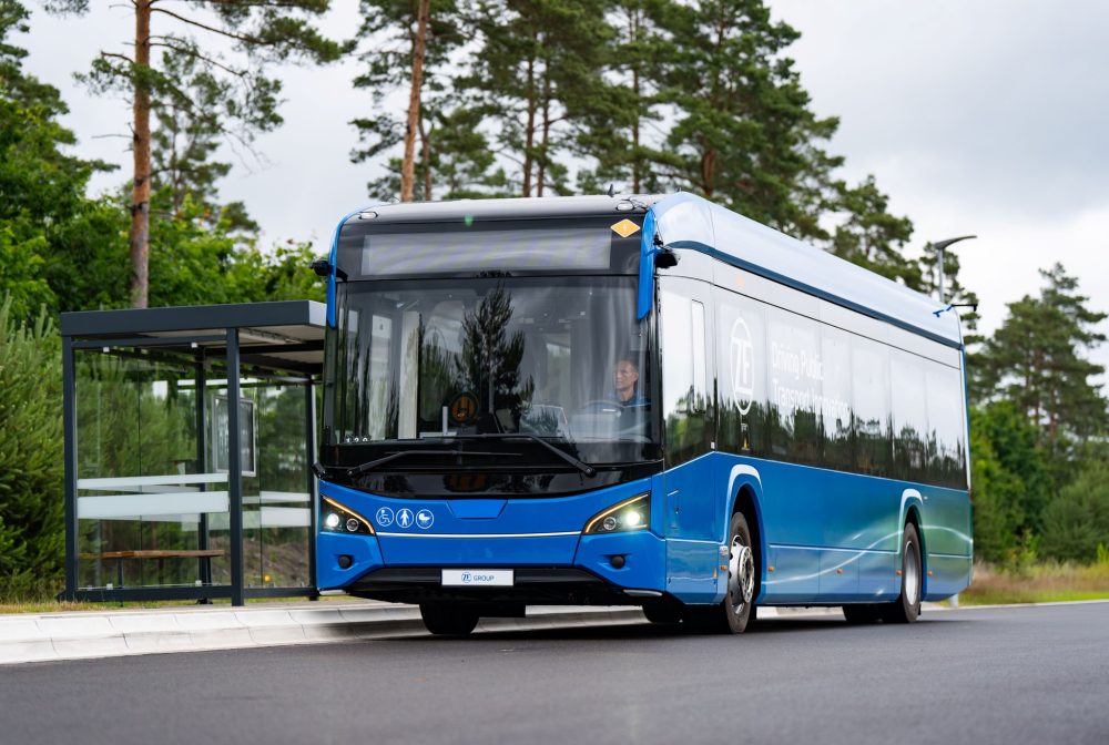 ZF City Bus Assist demonstration bus approaching a bus stop shelter